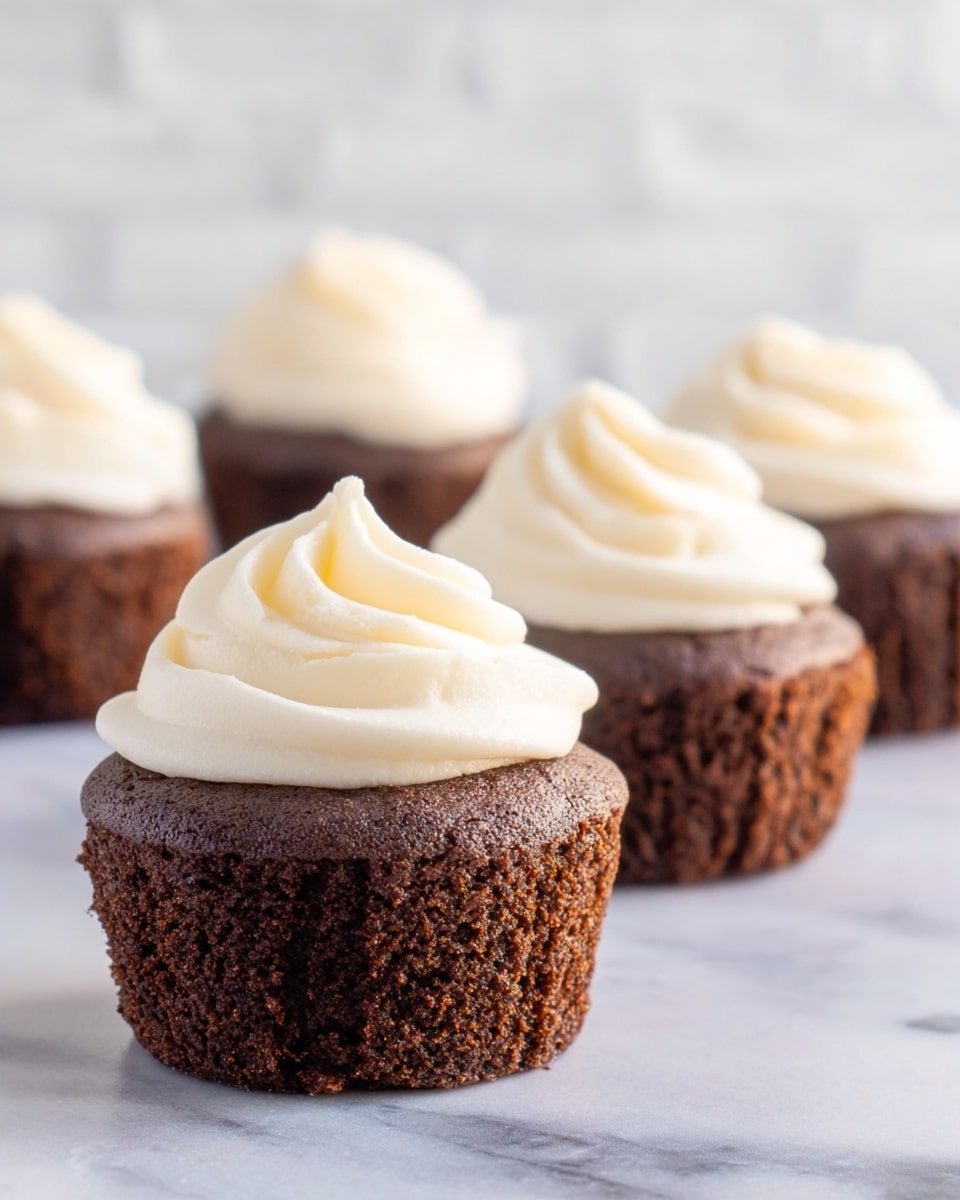 Zucchini Chocolate Chip Muffins with Cream Cheese Frosting
